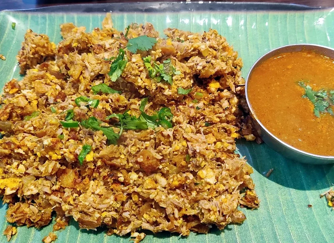 Veg kothu paratha: chopped paratha stir-fried with onion, green chilli and coriander, with salna on the side