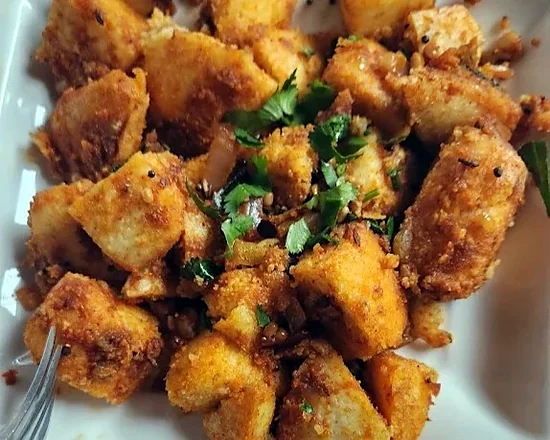 Ghee podi idly pieces tossed in spice powder with coriander